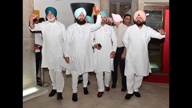 Leader of Opposition Partap Singh Bajwa along with other Congress MLAs walk out of the Punjab vidhan sabha on Friday. (Ravi Kumar/HT)