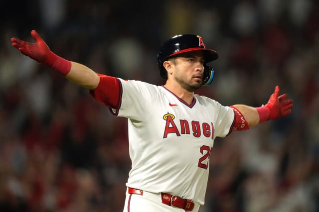 The Angels’ Travis d’Arnaud gestures after hitting a walk-off RBI single during the ninth inning to give his team a 6-5 victory over the Arizona Diamondbacks on Friday night at Angel Stadium. (AP Photo/Mark J. Terrill)