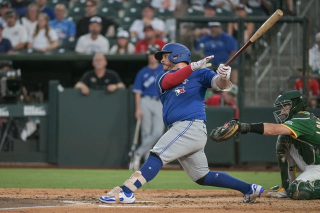 Jul 11, 2025; West Sacramento, California, USA; Toronto Blue Jays catcher Alejandro Kirk (30) hits a single against the Athletics during the fifth inning at Sutter Health Park. Ed Szczepanski-Imagn Images