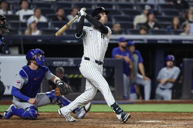 Jul 11, 2025; Bronx, New York, USA;  New York Yankees center fielder Cody Bellinger (35) hits a two run home run,  his third home run of the game, in the eighth inning against the Chicago Cubs at Yankee Stadium. Wendell Cruz-Imagn Images
