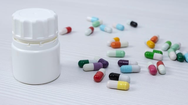 A worker was jailed in China for secretly drugging a colleague with sedatives to steal work plans.