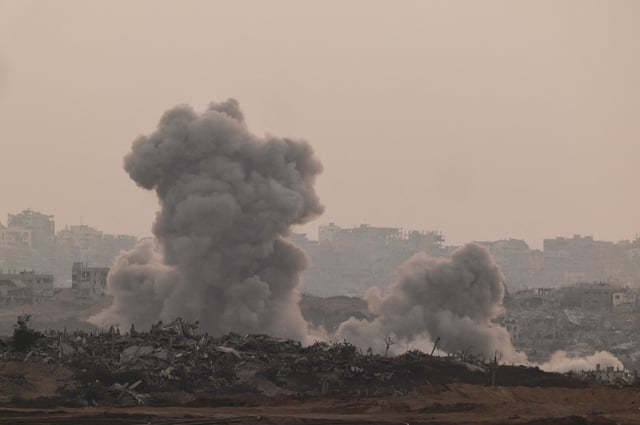 Smoke rises from Gaza after an explosion, as seen from the Israeli side of the Israel-Gaza border, July 10, 2025. REUTERS/Amir Cohen/File Photo