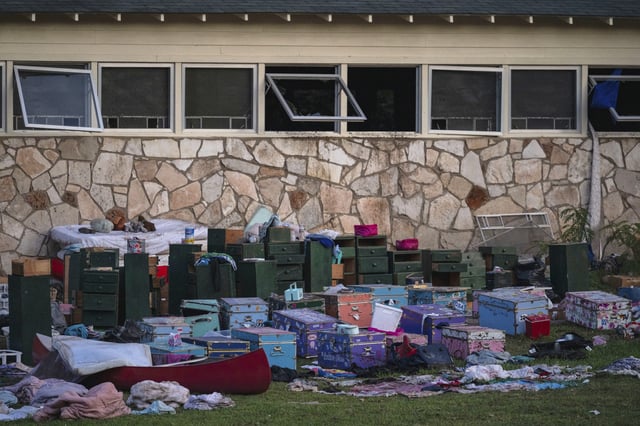 FILE - The belongings of campers sit outside one of Camp Mystic's cabins near the Guadalupe River in Hunt, Texas, on Monday, July 7, 2025, after a deadly flash flood swept through the area. (AP Photo/Eli Hartman, File)