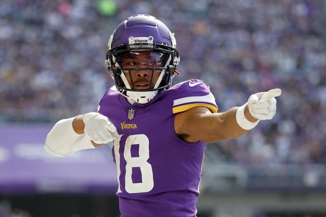 Justin Jefferson #18 of the Minnesota Vikings celebrates a first down catch against the Chicago Bears during the first quarter at U.S. Bank Stadium on October 09, 2022 in Minneapolis, Minnesota.