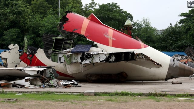 Wreckage of the Air India Boeing 787-8 Dreamliner plane sits on the open ground, outside Sardar Vallabhbhai Patel International Airport, where it took off and crashed nearby shortly afterwards, in Ahmedabad.