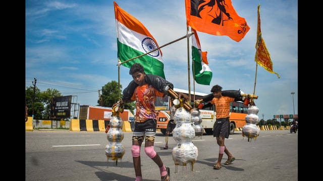 ‘Kanwariyas’ carry holy water during the ‘Kanwar Yatra’ in Meerut on Saturday. (PTI)