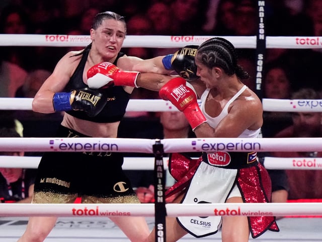 Ireland's Katie Taylor, left, punches Puerto Rico's Amanda Serrano during the ninth round of a super lightweight championship boxing match Saturday, July 12, 2025, in New York. (AP Photo/Frank Franklin II)