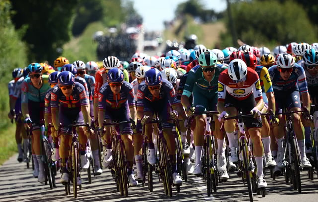 Cycling - Tour de France - Stage 8 - Saint-Meen-le-Grand to Laval - Laval, France - July 12, 2025 Lidl - Trek's Jonathan Milan wearing the green jersey in action in the peloton during stage 8 REUTERS/Sarah Meyssonnier