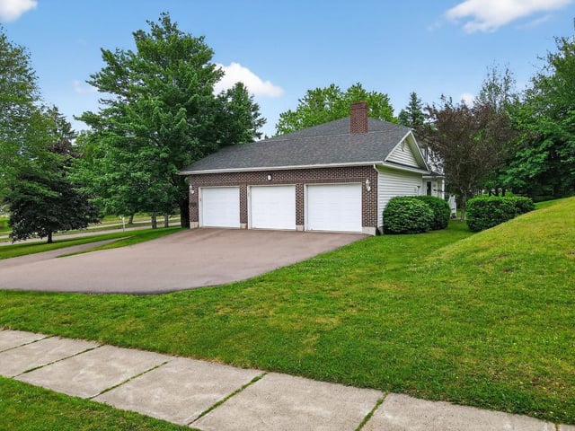  The attached three-vehicle garage.