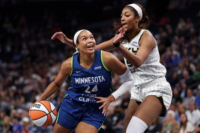 Napheesa Collier #24 of the Minnesota Lynx works around Angel Reese #5 of the Chicago Sky during the first quarter of a preseason game at Target Center on May 10, 2025 in Minneapolis, Minnesota.