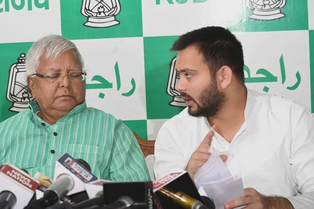 Patna: RJD leaders Lalu Prasad Yadav and Tejashwi Yadav during a press conference in Patna on Sept 12, 2017. (Photo: IANS)