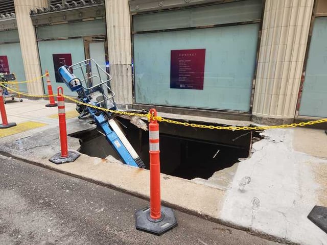 A hole in the sidewalk outside of 175 W Jackson Blvd. The pavement collapsed Saturday morning under a service lift.