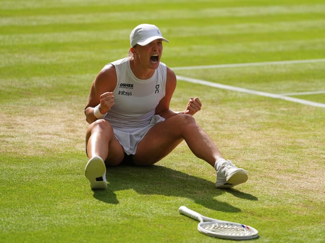 Iga Swiatek of Poland celebrates winning the women's singles final match against Amanda Anisimova of the U.S. at the Wimbledon Tennis Championships in London, Saturday, July 12, 2025.(AP Photo/Kirsty Wigglesworth)