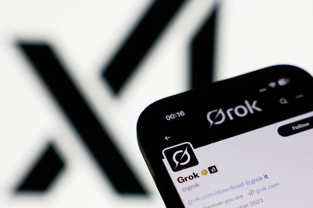 The xAI logo and Grok account on X displayed on a phone screen in a illustration photo taken in London on July 9. XAI apologized Saturday for antisemitic social media posts this week.