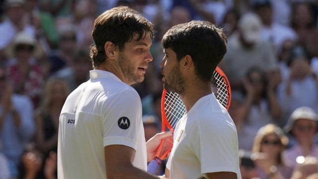 Spain's Carlos Alcaraz, right, greets Taylor Fritz of the US after beating him in their Wimbledon semi-final. (AP)