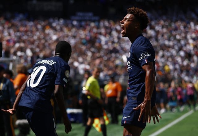 Ousmane Dembele and Desire Doue celebrate a goal in the semifinals against Real Madrid.