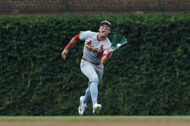 Jul 4, 2025; Chicago, Illinois, USA; St. Louis Cardinals left fielder Lars Nootbaar (21) catches a fly ball hit by Chicago Cubs catcher Carson Kelly during the third inning at Wrigley Field. Mandatory Credit: Kamil Krzaczynski-Imagn Images/File Photo