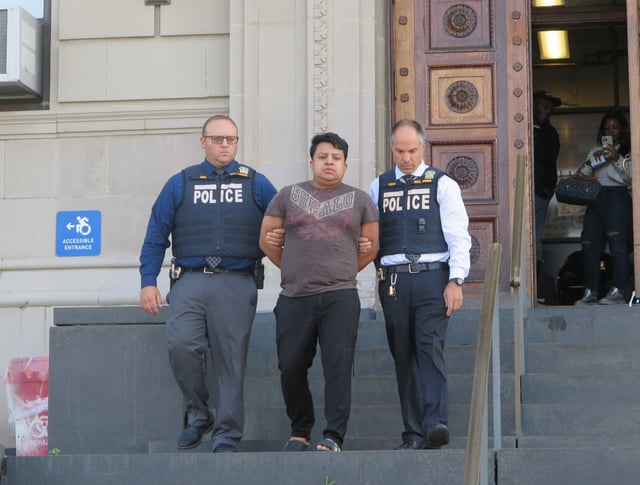 Juventino Anastacio Florentino is walked out of the 120th Precinct in Staten Island, New York on Friday. July 11, 2025. (Rose Abuin/New York Daily News)