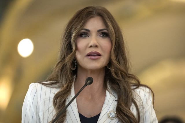 Homeland Security Secretary Kristi Noem speaks during a news conference where she announced that most airline passengers will no longer have to remove their shoes at security checkpoints on Tuesday, July 8, 2025, at Reagan National Airport in Washington.