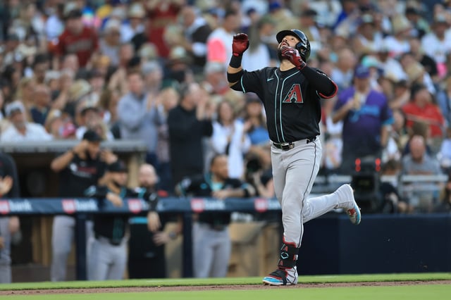 SAN DIEGO, CALIFORNIA - JULY 09: Eugenio Suárez #28 of the Arizona Diamondbacks reacts after hitting a solo homerun during the fourth inning of a game against the San Diego Padres at Petco Park on July 09, 2025 in San Diego, California.