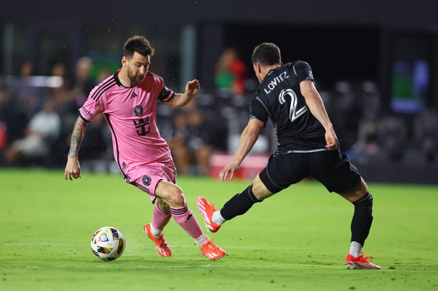 Lionel Messi #10 of Inter Miami makes a move on Daniel Lovitz #2 of Nashville SC during the second half at DRV PNK Stadium on April 20, 2024 in Fort Lauderdale, Florida.