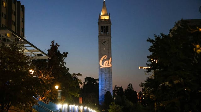 The Campanile is lit before sunrise during the College GameDay, ESPN’s college football pregame show at UC Berkeley’s Memorial Glade in Berkeley, California, on Oct. 5, 2024. A masked gunman fatally shot a UC Berkeley business professor while he visited his kids in Greece, according to several media reports. (Ray Chavez/Bay Area News Group/TNS)