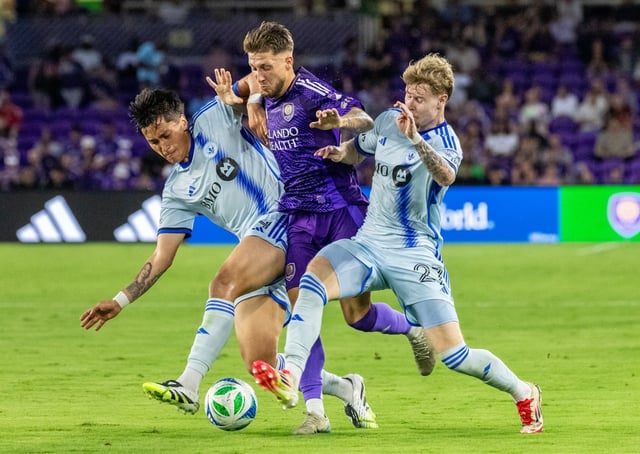 Orlando City forward Marco Pašalić (87) fights for  control of the ball with CF Montréal defender Fernando Álvarez (4) and defender Dawid Bugaj (27) during their soccer match at the Inter &amp; Co Stadium in Orlando, Fla., Saturday, July 12, 2025. (Willie J. Allen Jr./Orlando Sentinel)