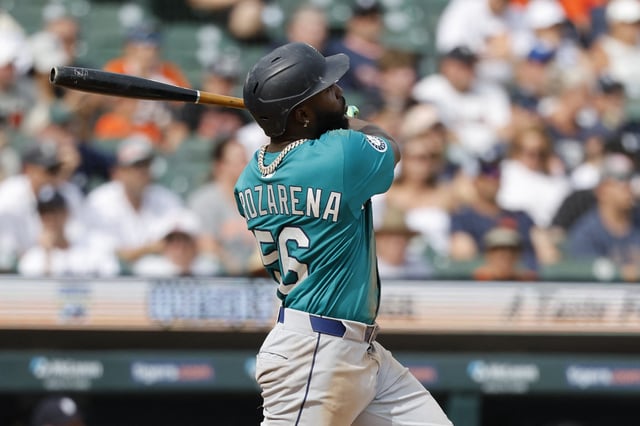 Jul 12, 2025; Detroit, Michigan, USA; Seattle Mariners outfielder Randy Arozarena (56) hits a two run home run in the eighth inning against the Detroit Tigers at Comerica Park.  Rick Osentoski-Imagn Images