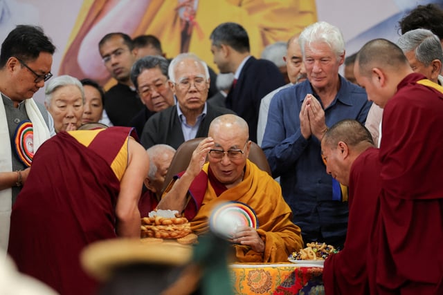 Tibetan spiritual leader, the 14th Dalai Lama, is served food on his 90th birthday celebration at the Tsuglagkhang, also known as the Dalai Lama Temple complex, in the northern town of Dharamshala, India, July 6, 2025. REUTERS/Anushree Fadnavis/File Photo