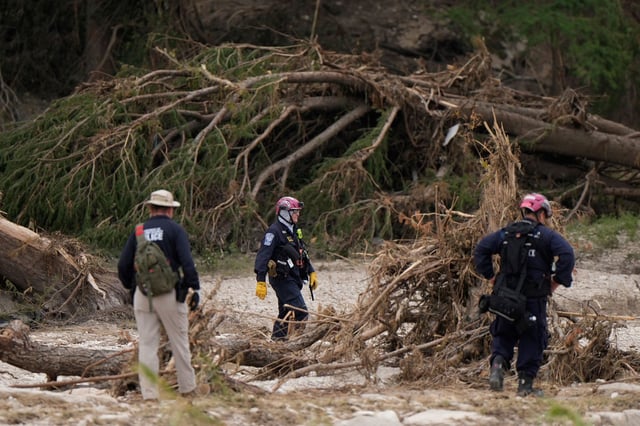 Members of Nevada Task Force 1 search for missing flood victims in Kerrville, Texas, on July 11.