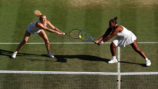Katerina Siniakova of Czechia and partner Taylor Townsend of United States reach to play a backhand against Su-Wei Hsieh of Chinese Taipei and Jelena Ostapenko of Latvia during the Ladies&#39; Doubles semi-final match on day twelve of The Championships Wimbledon 2025 at All England Lawn Tennis and Croquet Club on July 11, 2025 in London, England.