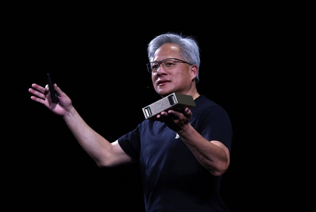 Jensen Huang, CEO of Nvidia, holds a NVIDIA DGX Cloud Lepton as he speaks during the Viva Technology conference dedicated to innovation and startups at Porte de Versailles exhibition center in Paris, France, June 11, 2025. REUTERS/Gonzalo Fuentes/File Photo