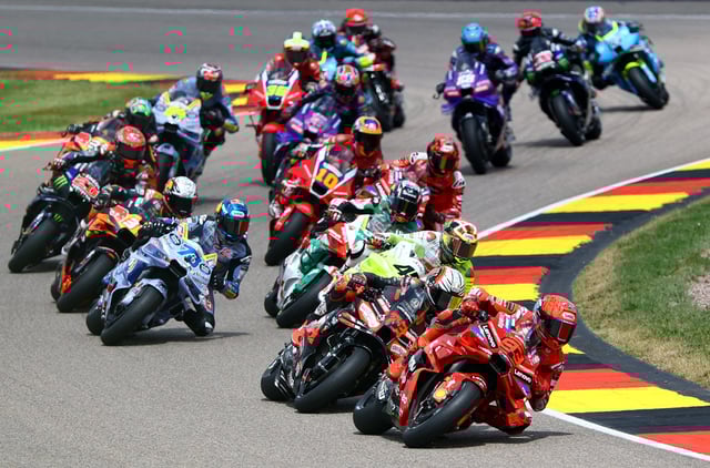 MotoGP - German Grand Prix - Sachsenring, Hohenstein-Ernstthal, Germany - July 13, 2025 Ducati Lenovo Team's Marc Marquez, BK8 Gresini Racing MotoGP's Alex Marquez and Aprilia Racing's Marco Bezzecchi in action with riders during the race REUTERS/Lisi Niesner