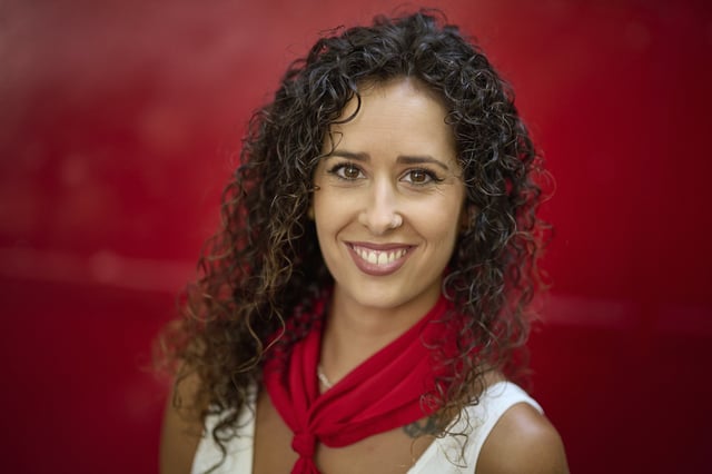Bull-runner Omara Martinez poses for a portrait during the San Fermín festival in Pamplona, northern Spain, on Friday, July 11, 2025. (AP Photo/Miguel Oses)