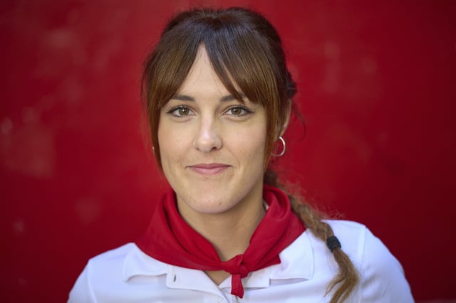Bull-runner Sara Puñal poses for a portrait during the San Fermín festival in Pamplona, northern Spain, on Friday, July 11, 2025. (AP Photo/Miguel Oses)