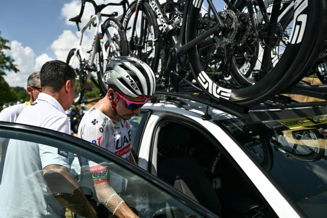 Joao Almeida climbing into his team car