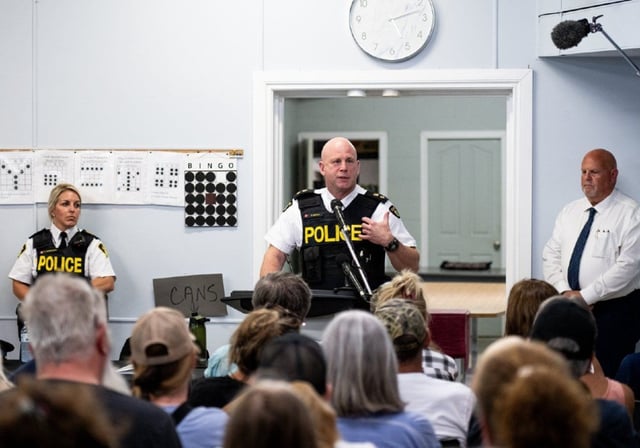 Ontario Provincial Police acting Chief Supt. Derek Needham speaks to residents of Quadeville, Ont., during a town hall meeting at a local community centre on Saturday, July 12, 2025.