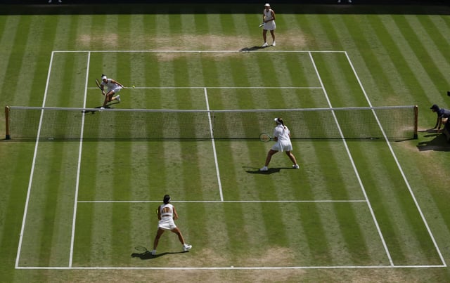 Tennis - Wimbledon - All England Lawn Tennis and Croquet Club, London, Britain - July 13, 2025 Latvia's Jelena Ostapenko and Taiwan's Hsieh Su-wei in action during their women's doubles final match against Russia's Veronika Kudermetova and Belgium's Elise Mertens REUTERS/Stephanie Lecocq