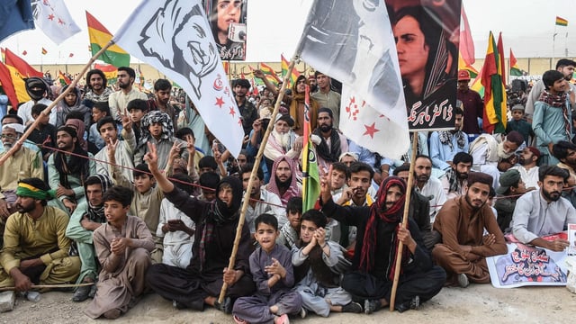 Supporters of the Balochistan National Party (BNP) carry posters of arrested Baloch activist Mahrang Baloch during a protest in Quetta.