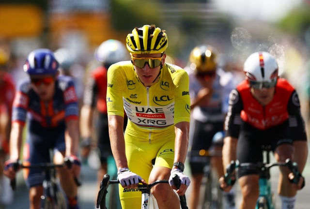 Cycling - Tour de France - Stage 9 - Chinon to Chateauroux - Chinon, France - July 13, 2025 UAE Team Emirates XRG's Tadej Pogacar wearing the yellow jersey crosses the finish line after stage 9 REUTERS/Sarah Meyssonnier