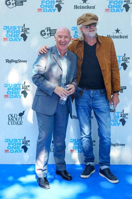 Bob Geldof and Midge Ure arrive for a special performance of the musical "Just For One Day", marking the 40th anniversary of the 1985 fundraiser Live Aid, at the Shaftesbury Theatre, in London, Britain, July 13, 2025. REUTERS/Isabel Infantes