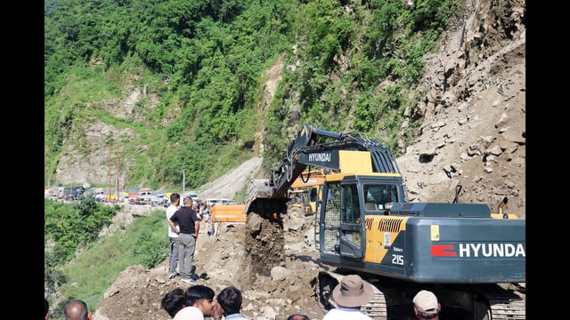Vehicle stranded after land slide at four miles Bindravani near Mandi on Sunday. (Birbal Sharma/HT)