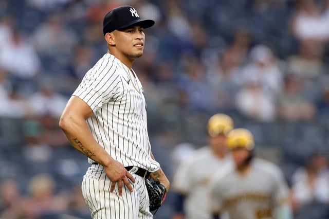 New York Yankees pitcher Jonathan Loaisiga reacts during the eighth inning of a baseball game against the Milwaukee Brewers, Saturday, Sept. 9, 2023, in New York. (AP Photo/Adam Hunger)