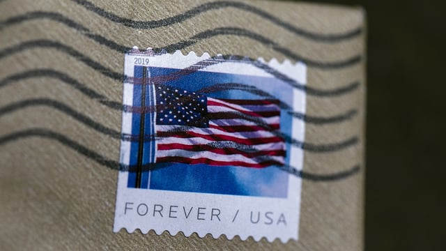 FILE – A stamp is shown on an envelope Friday, May 28, 2021, in Washington.