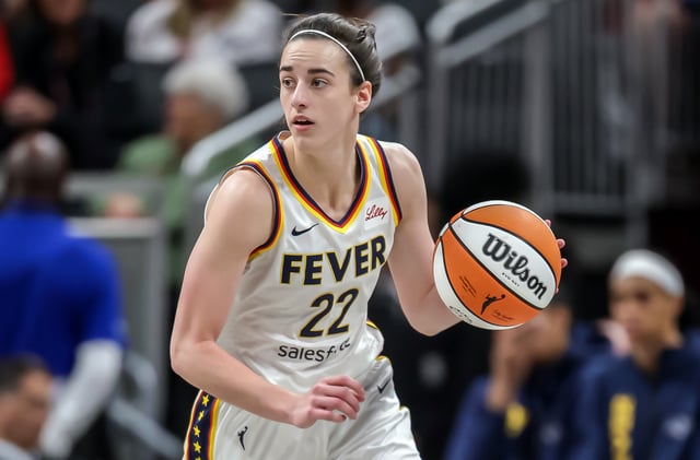 Caitlin Clark #22 of the Indiana Fever brings the ball up court during the game against the Golden State Valkyries at Gainbridge Fieldhouse on July 9, 2025 in Indianapolis, Indiana.