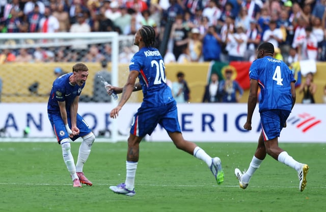 Soccer Football - FIFA Club World Cup - Final - Chelsea v Paris St Germain - MetLife Stadium, East Rutherford, New Jersey, U.S. - July 13, 2025 Chelsea's Cole Palmer celebrates with Tosin Adarabioyo after winning the FIFA Club World Cup final REUTERS/Kai Pfaffenbach