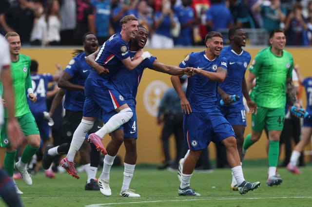 Soccer Football - FIFA Club World Cup - Final - Chelsea v Paris St Germain - MetLife Stadium, East Rutherford, New Jersey, U.S. - July 13, 2025 Chelsea's Cole Palmer and Tosin Adarabioyo celebrate winning the FIFA Club World Cup REUTERS/Lee Smith