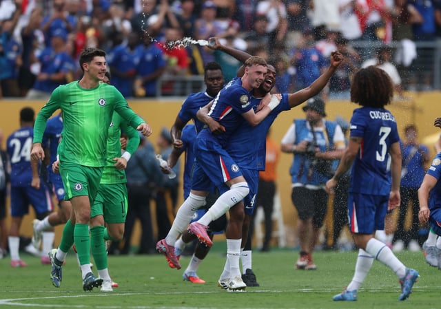 Soccer Football - FIFA Club World Cup - Final - Chelsea v Paris St Germain - MetLife Stadium, East Rutherford, New Jersey, U.S. - July 13, 2025 Chelsea's Cole Palmer and Tosin Adarabioyo celebrate winning the FIFA Club World Cup REUTERS/Lee Smith