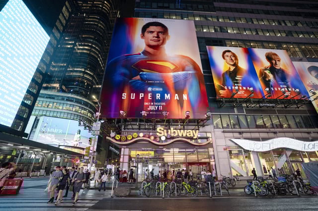 People cross the street near billboards advertising the new &#34;Superman&#34; film in Times Square on July 09, 2025 in New York City.