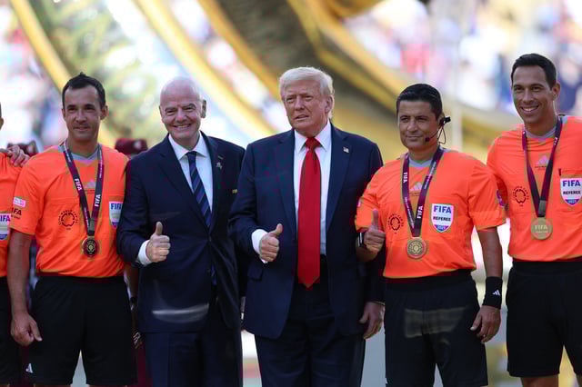 Soccer Football - FIFA Club World Cup - Final - Chelsea v Paris St Germain - MetLife Stadium, East Rutherford, New Jersey, U.S. - July 13, 2025 U.S. President Donald Trump and FIFA president Gianni Infantino pose for a photo with referee Alireza Faghani and his assistant referees REUTERS/Hannah Mckay